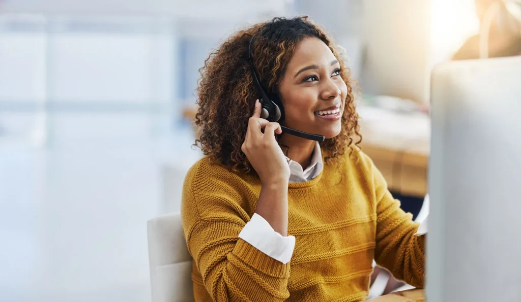 Her display of care in customers is great business. Shot of a female agent working in a call centre.